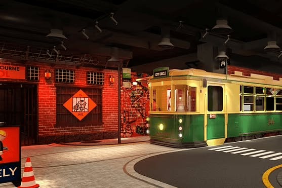 The inside of a theme park with a jail and a tram.